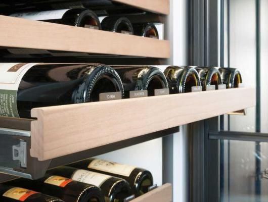 Wine bottles in wine refrigerator